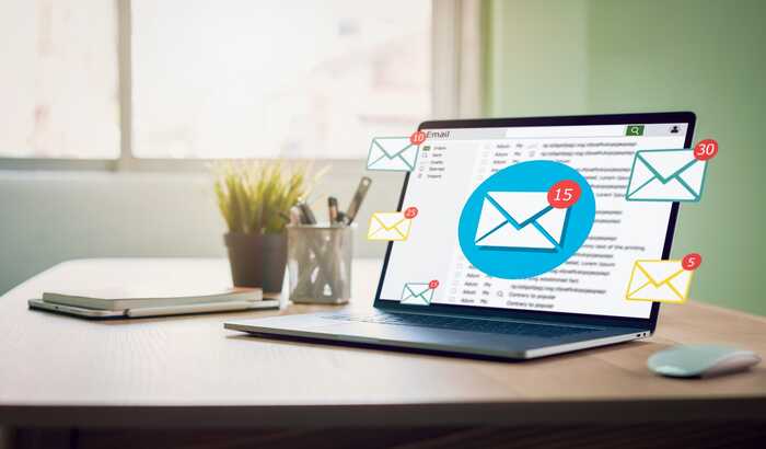 Laptop with lots of email newsletter marketing alerts Laptop with lots of email newsletter marketing alerts