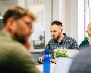 SEO experts working at a laptop